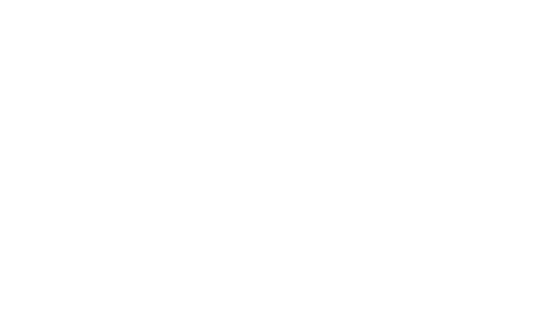 A woman types at a computer as she learns greater leaderships skills with her nanolearning from gotara.